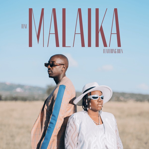 The image is the cover art for the song "Malaika" by Teni featuring Bien. It depicts two artists standing back-to-back in an open field under a clear blue sky. Teni, on the right, is wearing a white hat and sunglasses with a white outfit, while Bien, on the left, is dressed in a stylish jacket and sunglasses. The title "MALAIKA" is prominently displayed at the top in large, elegant letters, with "TENI" on the left and "FEATURING BIEN" on the right.